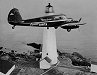 Flying Santa plane over Boston Light